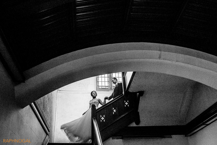 16-bride and groom walking down stairs at church