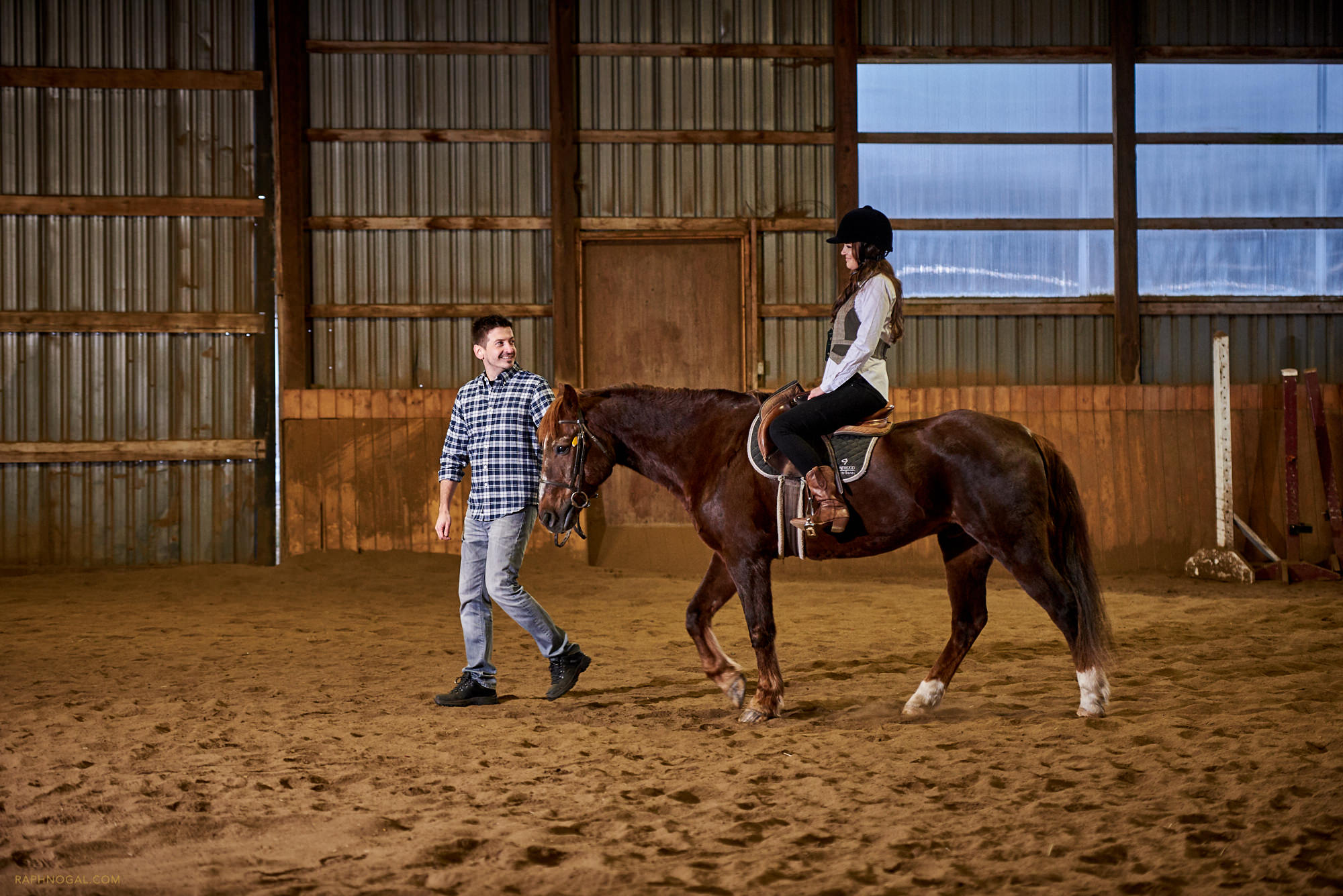 Riding the horse at Stonewood Equestrian during engagement photos