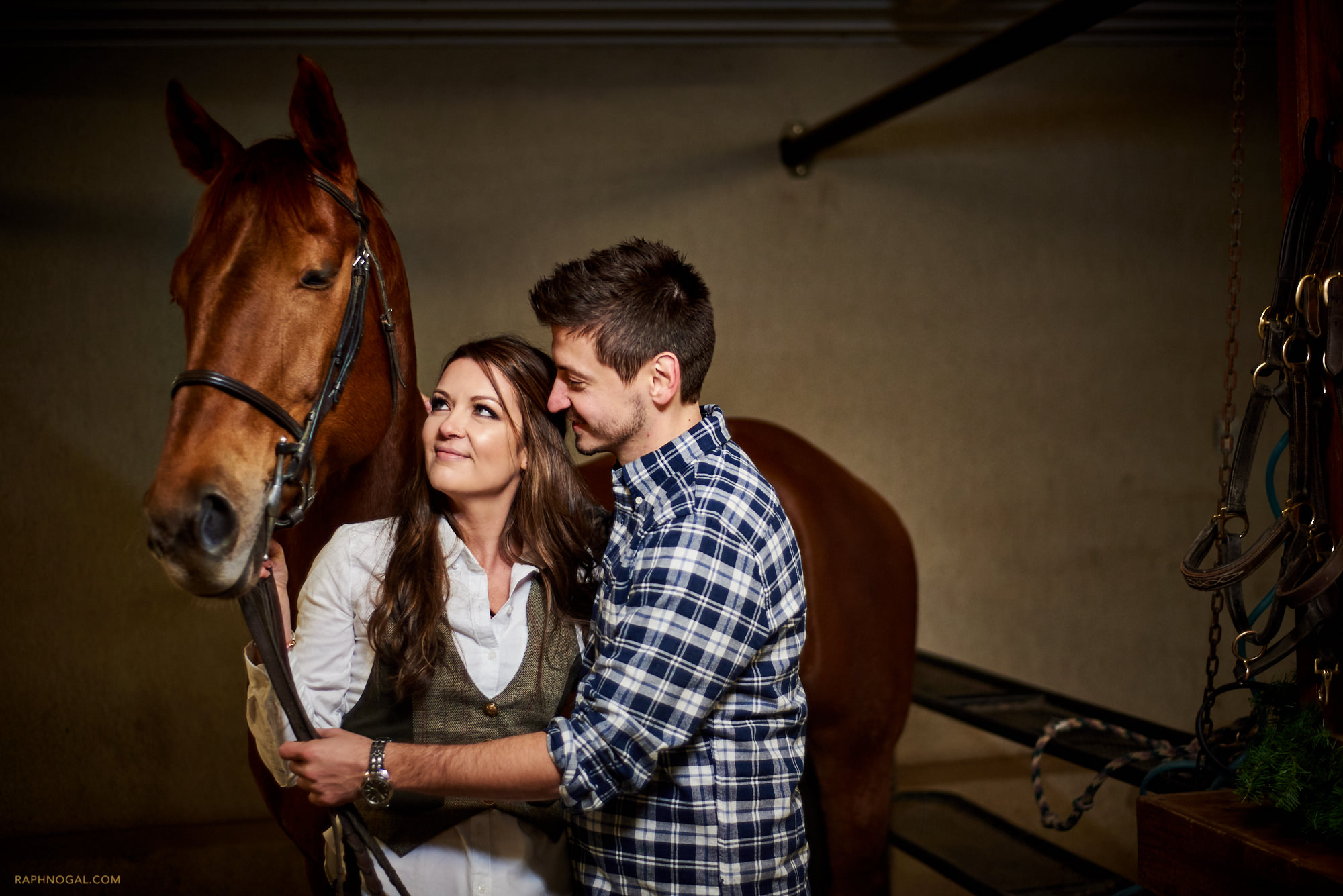 Couple with horse at stable insde Stonewood Equestrian 