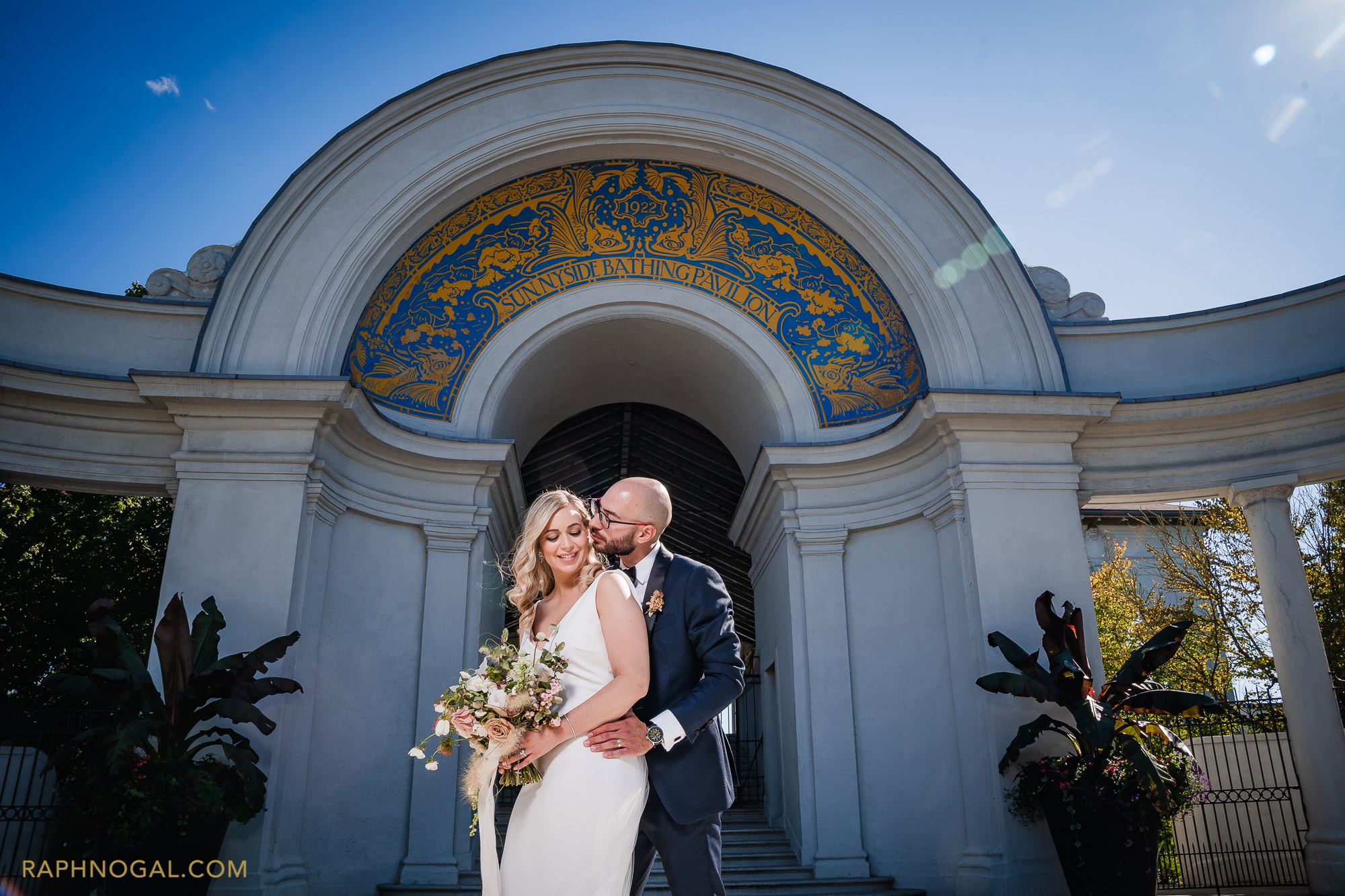 Couple hugging in front of Sunnyside Pavilion