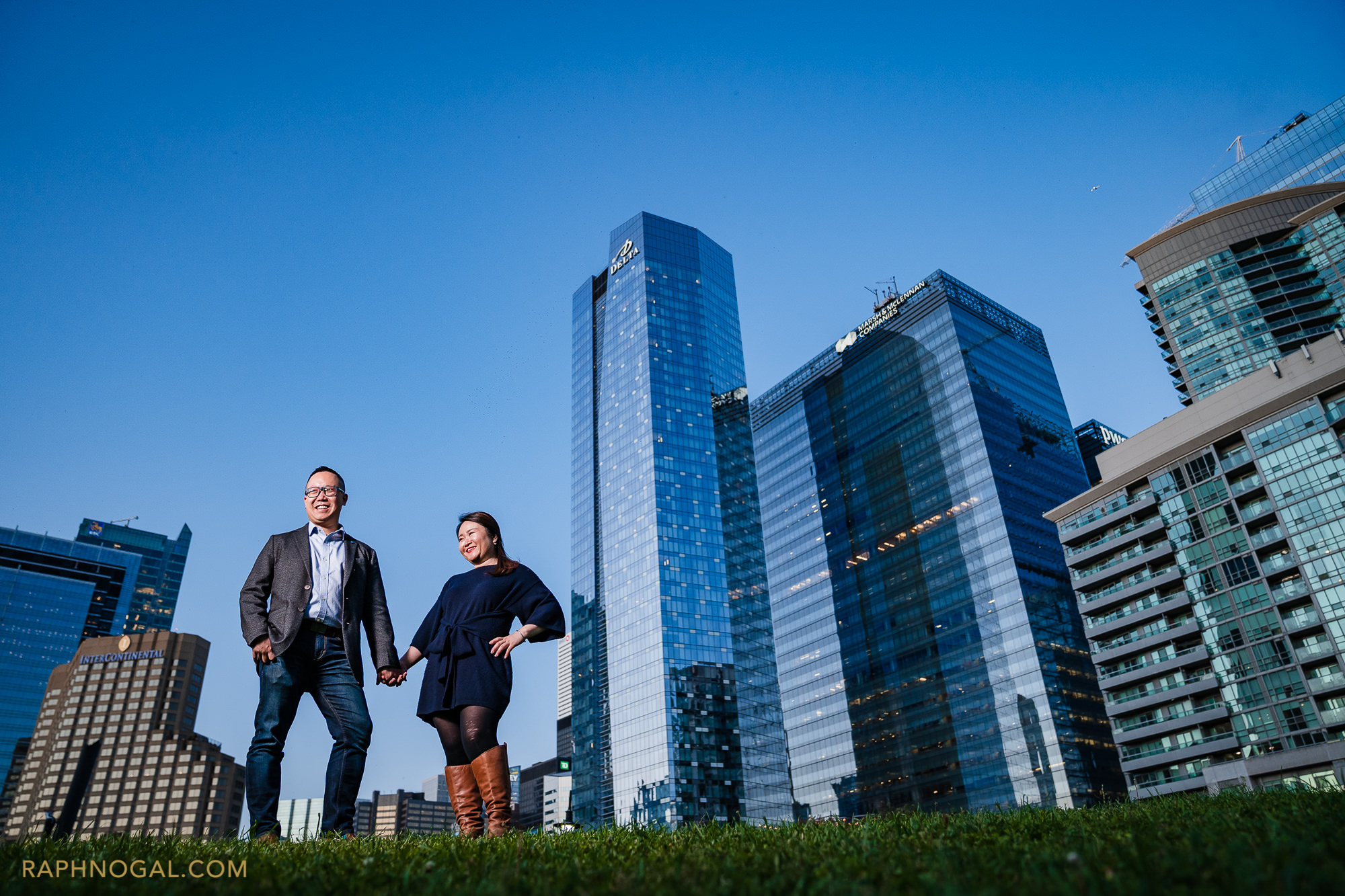 couple in front of downtown buildings