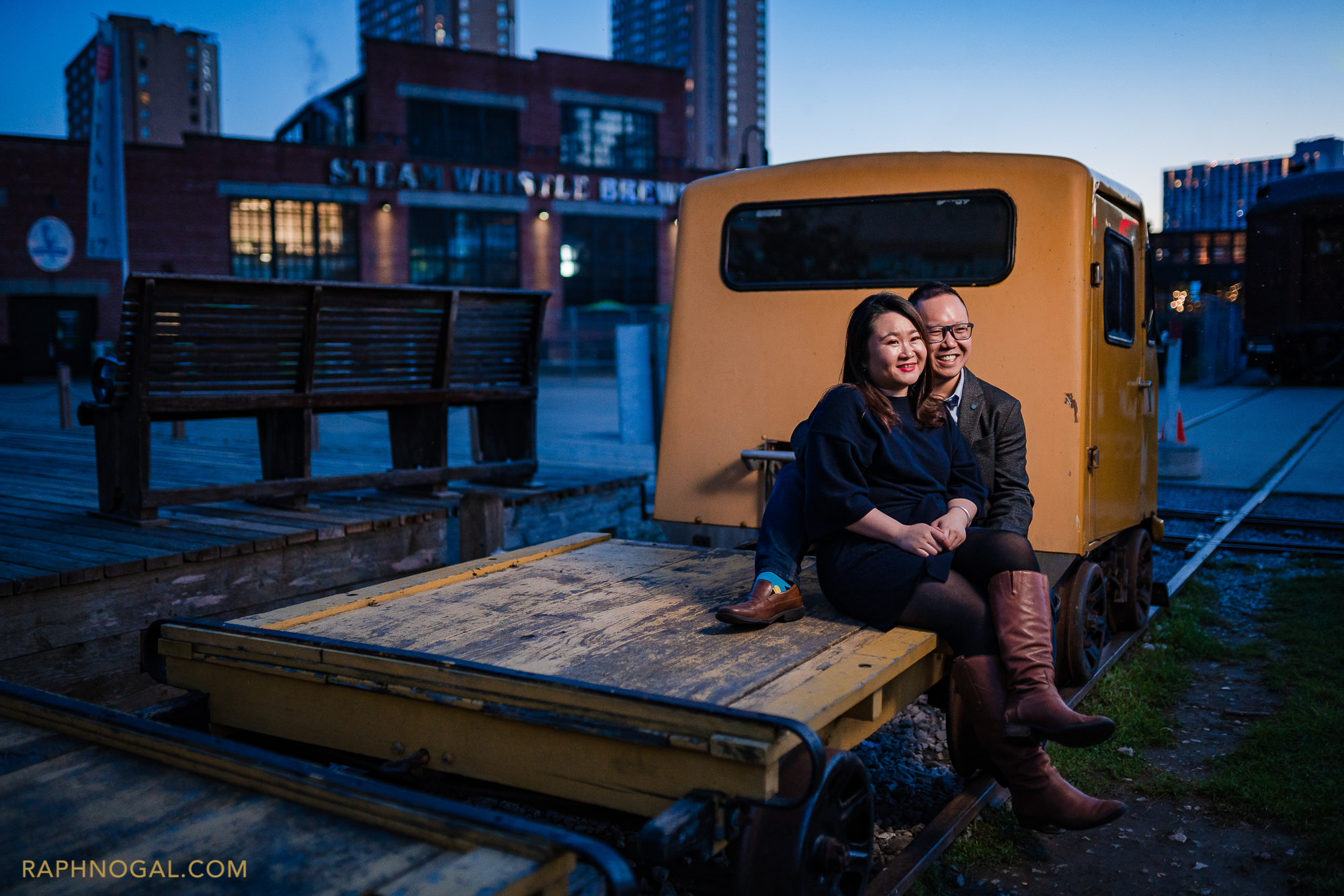 couple sitting on yellow truck