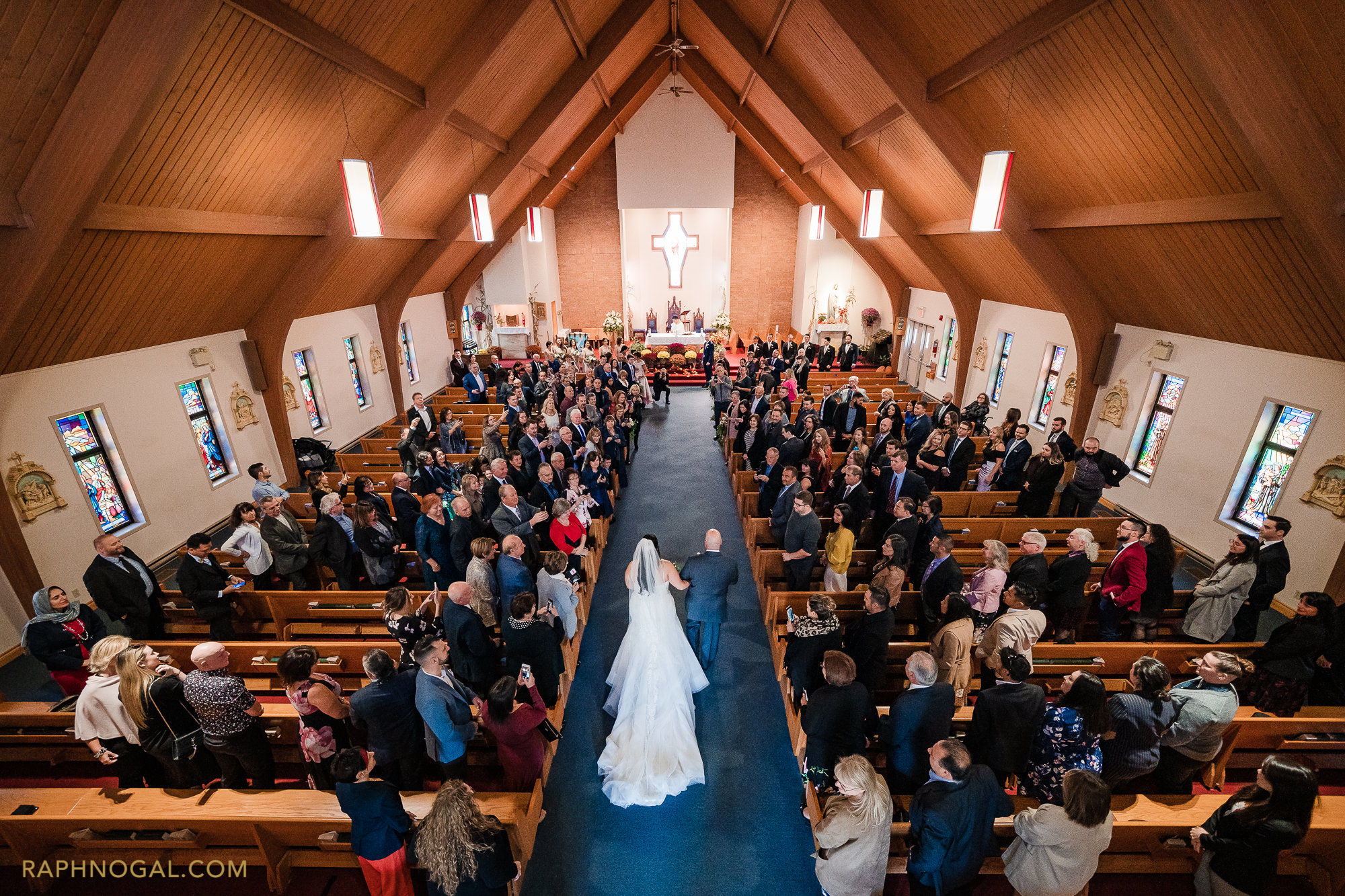 Bride walking down the isle with Dad, view from balcony