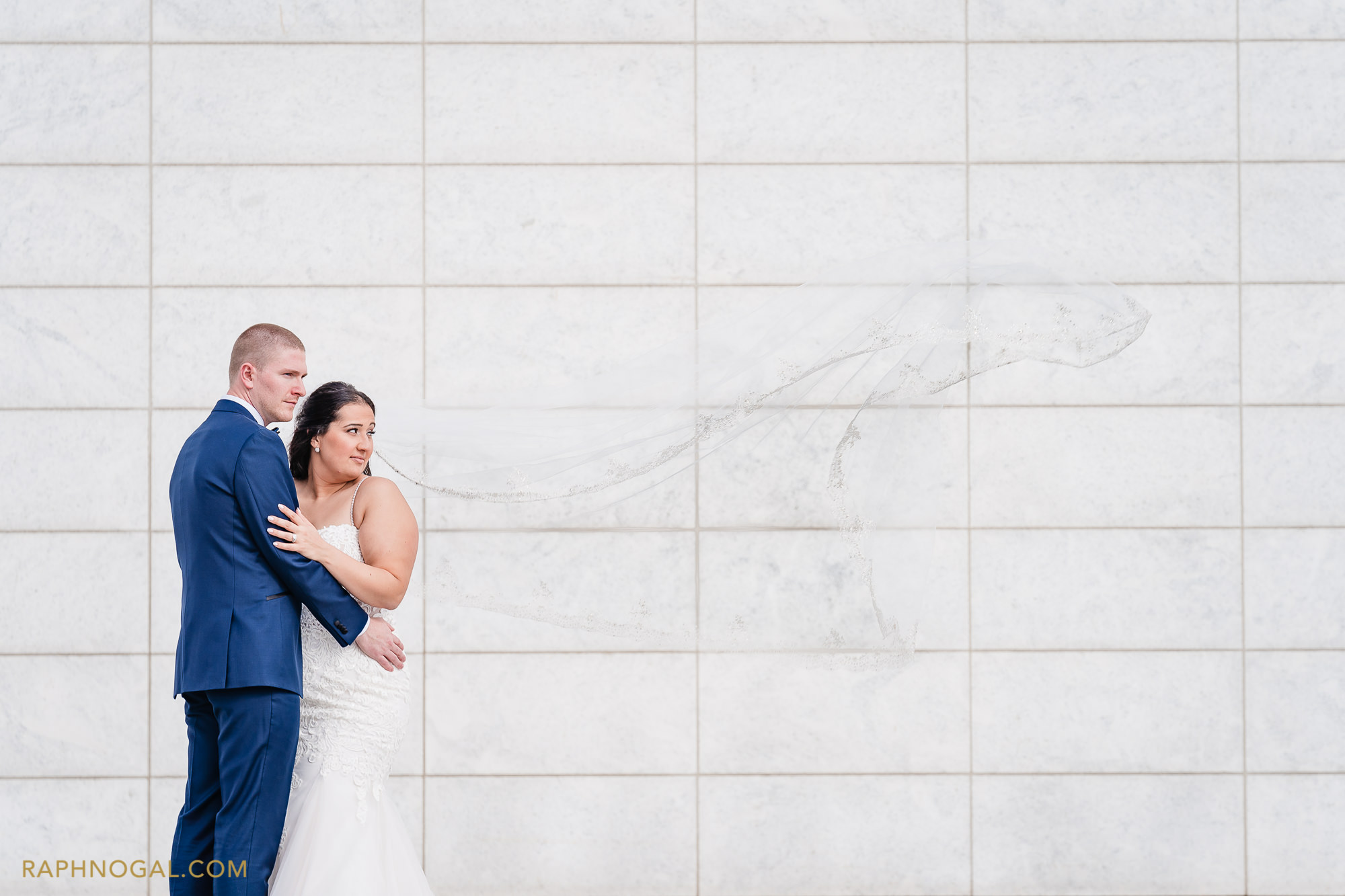 Bride and Groom at Aga Khan Museum and veil flies in the wind