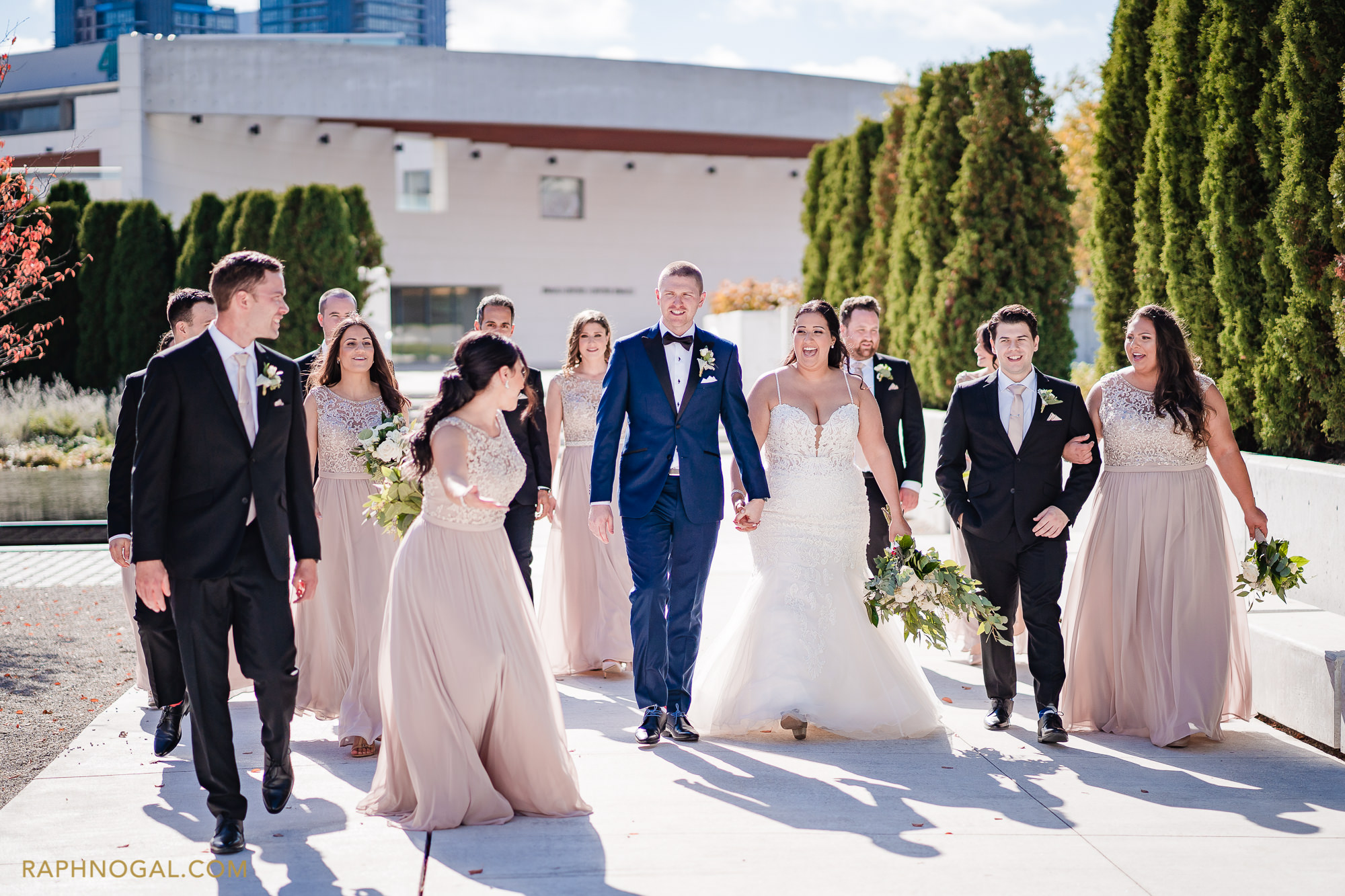 Wedding party walking the Aga Khan museum grounds