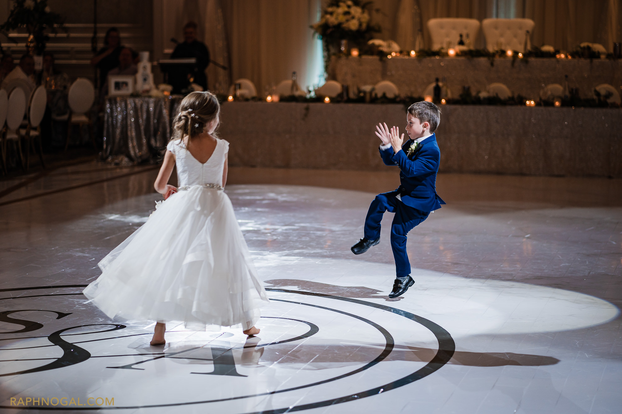 Ring boy and flower girl dance on the dance floor at Hazelton Manor